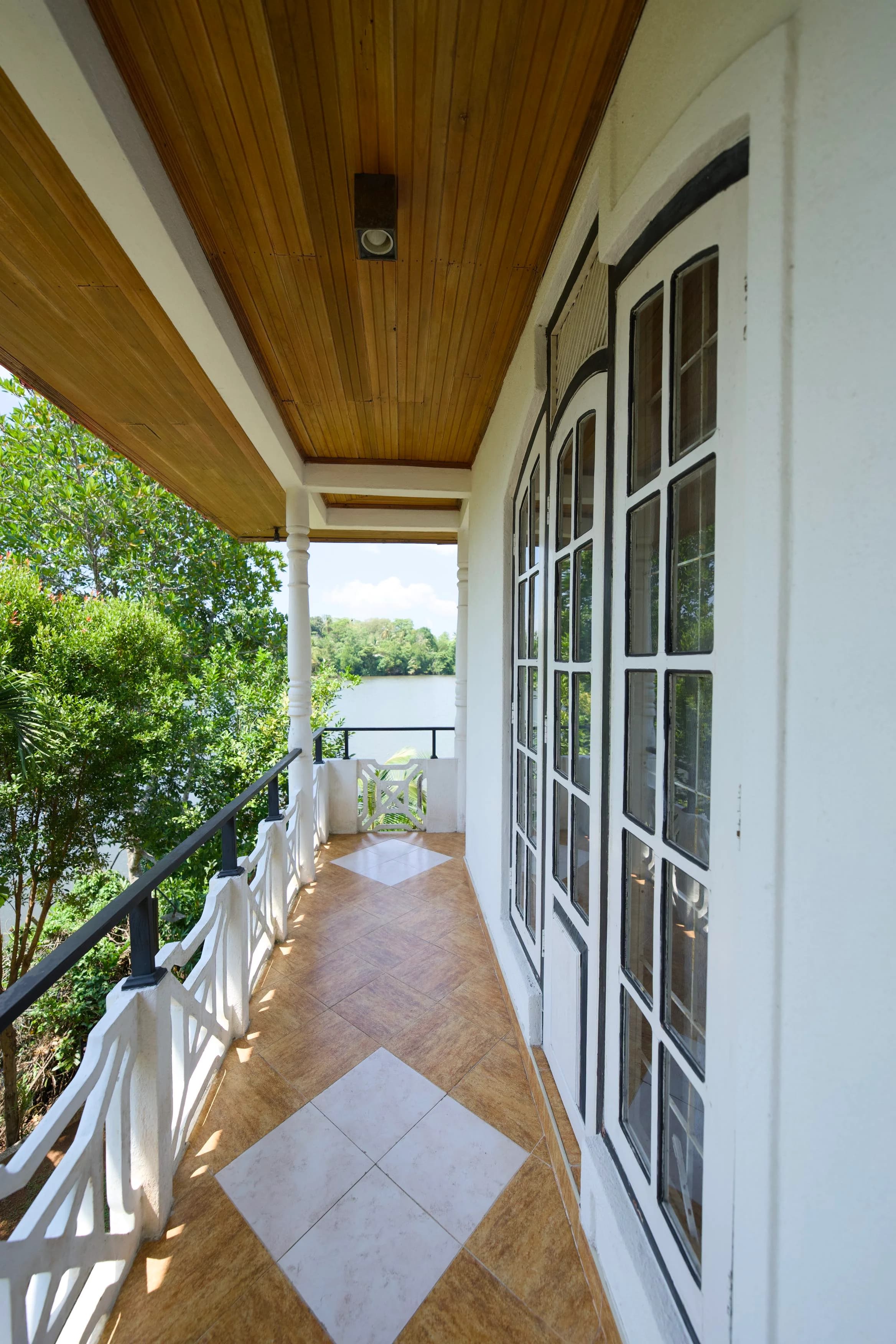 Private balcony with panoramic river views at Blended Villas Bentota